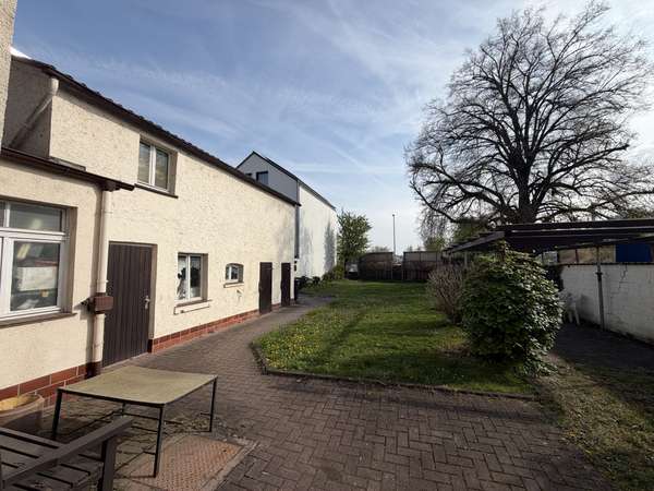 Historisches Mehrfamilienhaus mit drei Einheiten, großem Garten und Entwicklungspotenzial — Bild 23 von 25