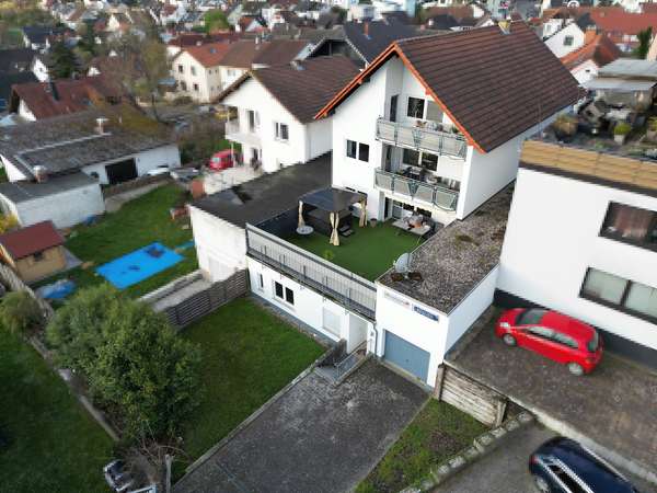 Gepflegtes Mehrfamilienhaus mit 3 Wohnungen im tollen Essenheim! — Bild 4 von 23