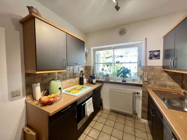 Wohlfühlort: Sonnige 3-Zimmerwohnung mit Tiefgaragenplatz in begehrter Hechtsheimer Feldrandlage — Bild 7 von 14