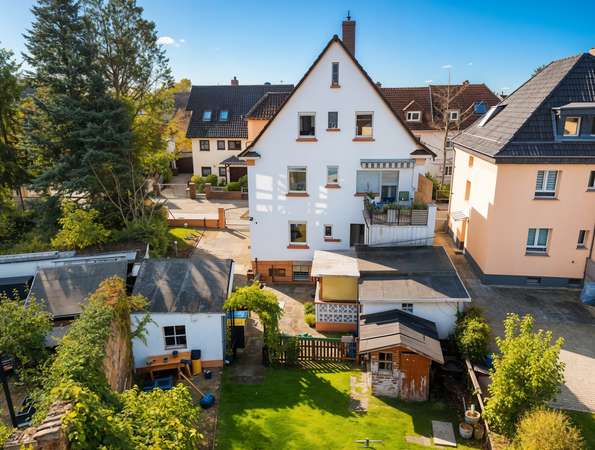 Für Investoren oder Eigennutzer: Charmantes Mehrfamilienhaus in zentraler Lage von Rüsselsheim — Bild 3 von 29
